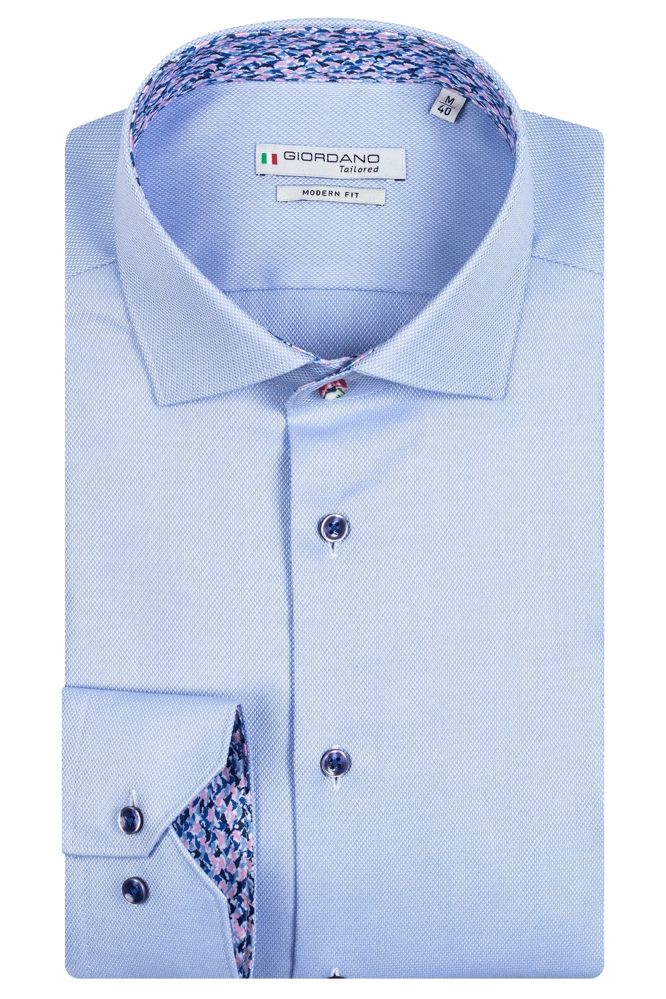 Giordano 100% cotton shirt. Light blue with navy buttons. Harringbone design. Soft pink and navy wave print lining on collar and cuff. The perfect summer light shirt. Dressed casually not tucked in, or more formal tucked in. Great paired with jeans and chinos but also shorts.